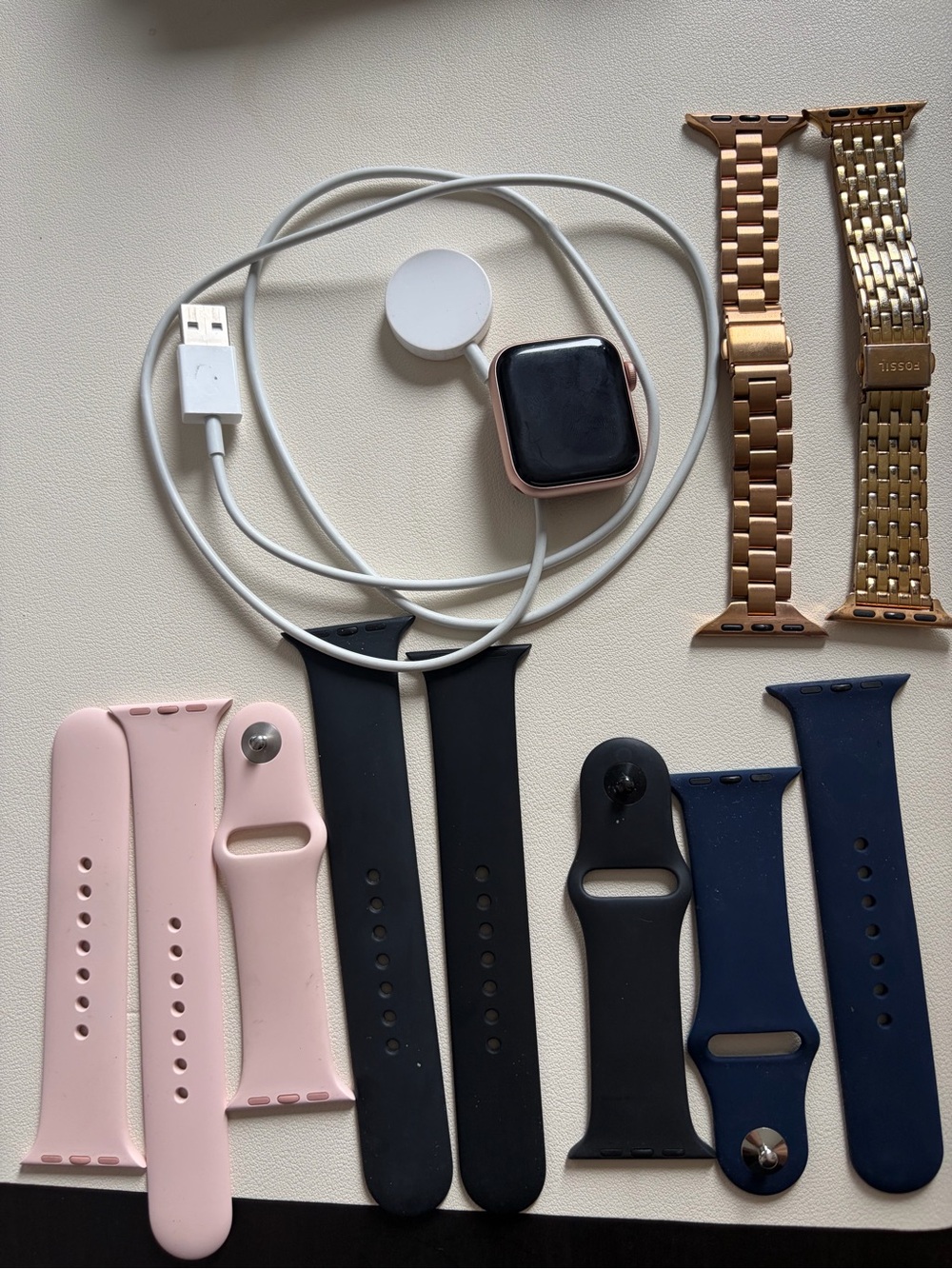 Apple Watch with Pink Gold Case and Pink, Black, Navy & Gold Bands